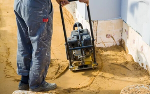 use a wacker plate in the sand