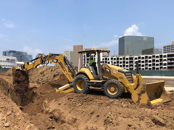 how to backfill a trench with a backhoe