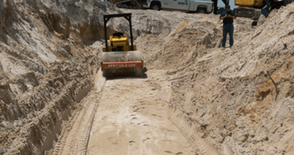 how to compact sand backfill