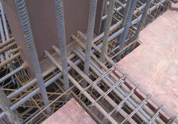 How does reinforcement contribute to the longevity and durability of concrete structures
